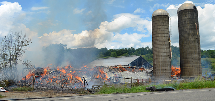 Fire destroys barn in Pharsalia; farmers and firemen save animals and nearby buildings